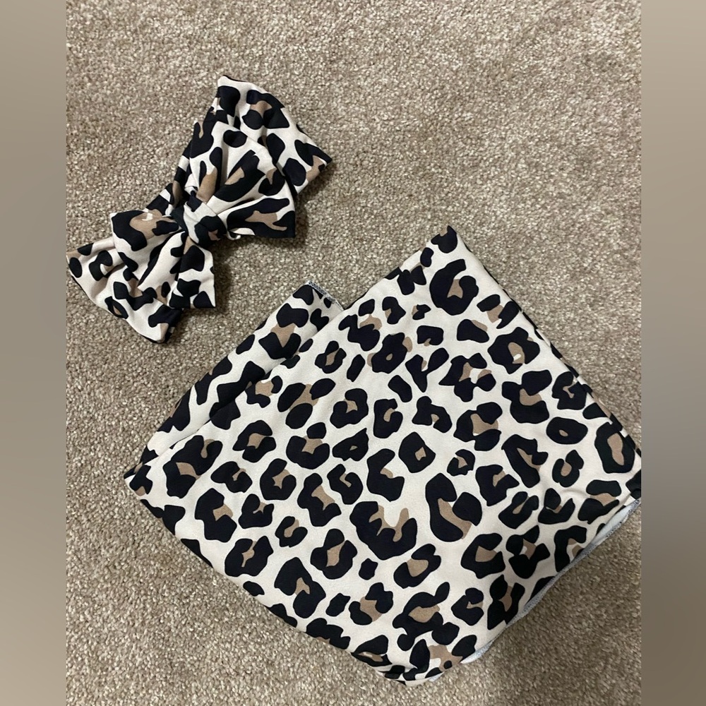 Baby swaddle and bow, like new Cheetah print